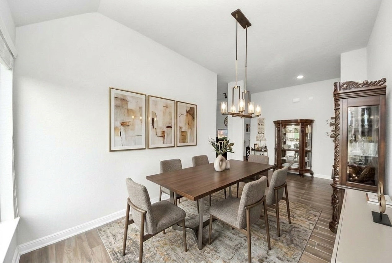 24503 Eucalyptus Way Spring, TX 77373 - Photo 17 of 27 a view of a dining room with furniture window and wooden floor