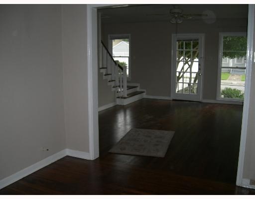 120 Cole Street Corpus Christi, TX 78404 - Photo 3 of 3 wooden floor in an empty room with a window