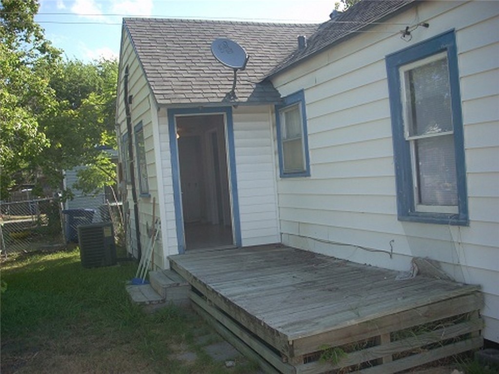 2333 Riggan Street Corpus Christi, TX 78404 - Photo 11 of 12 a wooden door with a yard
