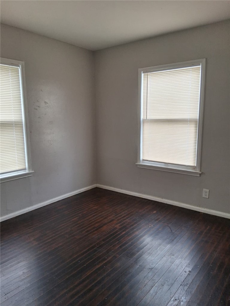 2333 Riggan Street Corpus Christi, TX 78404 - Photo 4 of 12 an empty room with wooden floor and windows