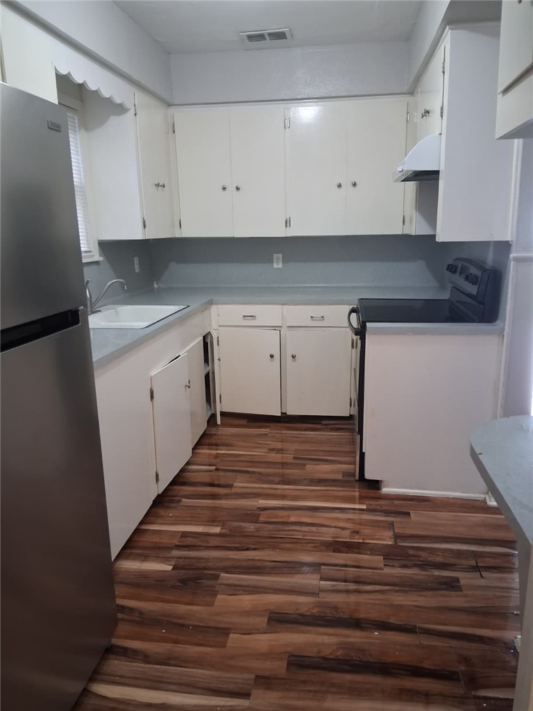 2333 Riggan Street Corpus Christi, TX 78404 - Photo 10 of 12 a view of cabinets and wooden floor