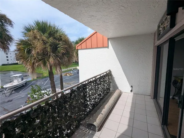 a balcony view with a potted plant
