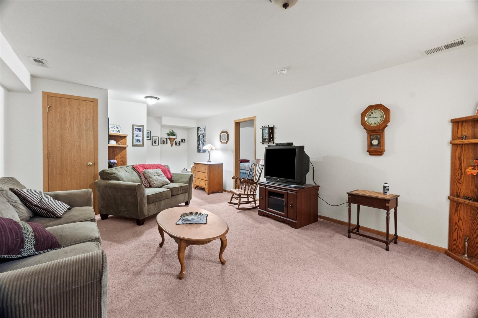 25426 Barrow Road Manhattan, IL 60442 - Photo 20 of 30 a living room with furniture a flat screen tv and a window