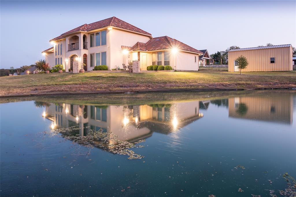 1755 Heifner Road Lucas, TX 75002 - Photo 1 of 35 a house view with a lake view
