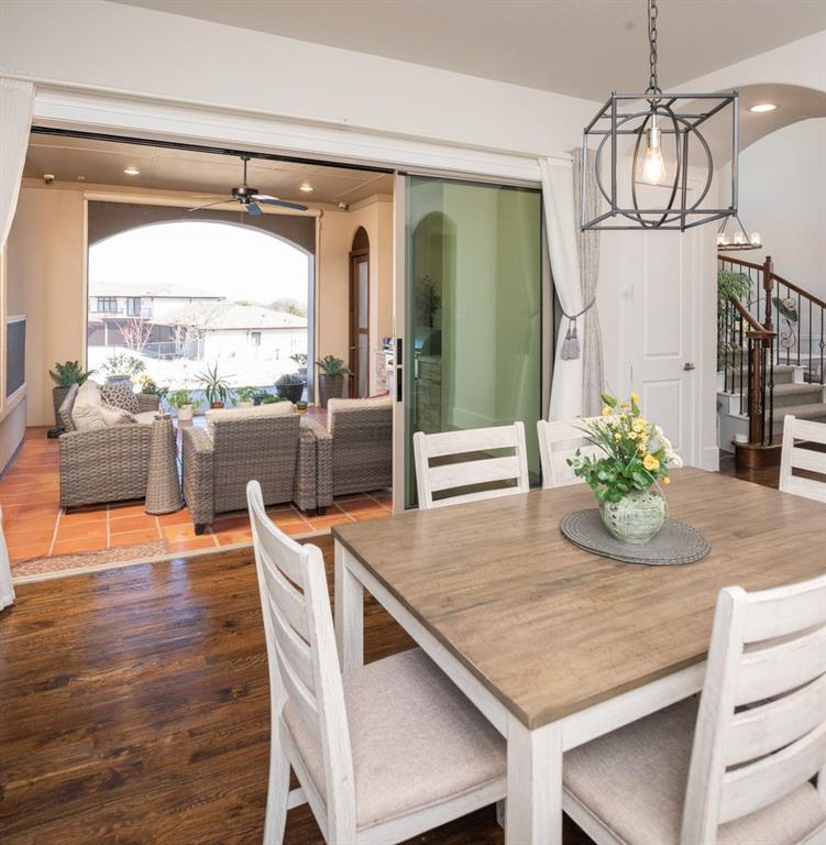 1755 Heifner Road Lucas, TX 75002 - Photo 16 of 35 a view of a dining room with furniture window and wooden floor