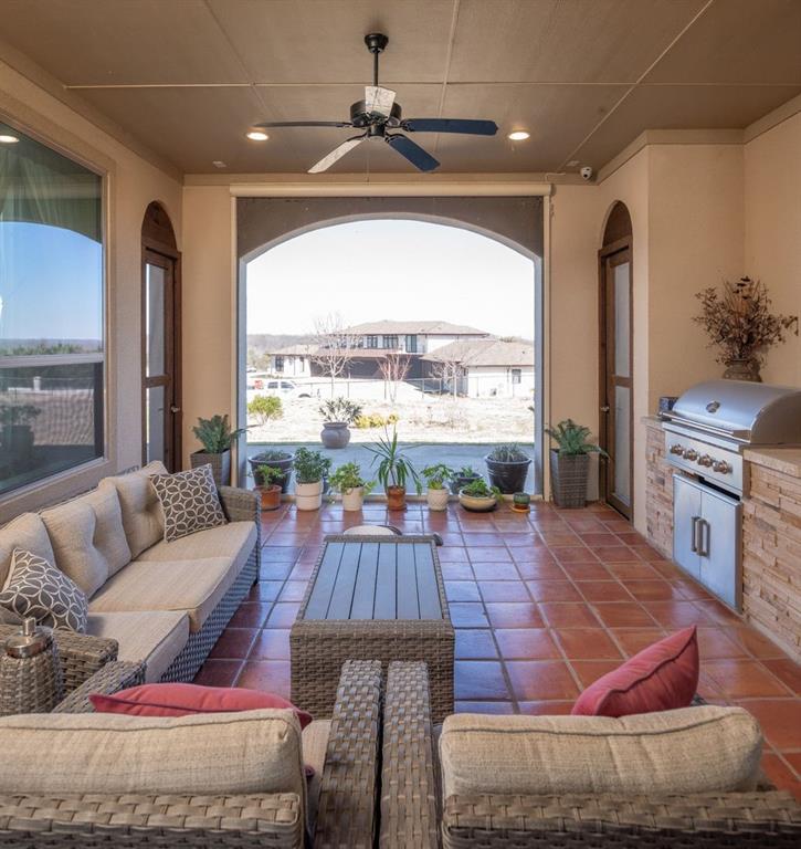 1755 Heifner Road Lucas, TX 75002 - Photo 17 of 35 a living room with furniture a large window with kitchen view