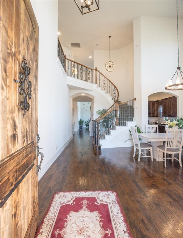 1755 Heifner Road Lucas, TX 75002 - Photo 2 of 35 a view of entryway dining room and hall with wooden floor