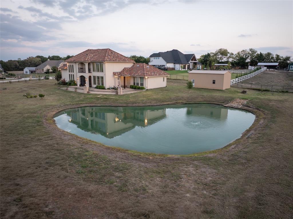 1755 Heifner Road Lucas, TX 75002 - Photo 29 of 35 an aerial view of residential houses with outdoor space and lake view