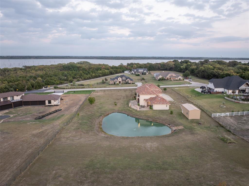 1755 Heifner Road Lucas, TX 75002 - Photo 30 of 35 a view of a swimming pool with a yard
