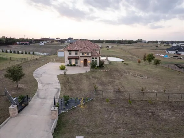 an aerial view of a house with a lake view