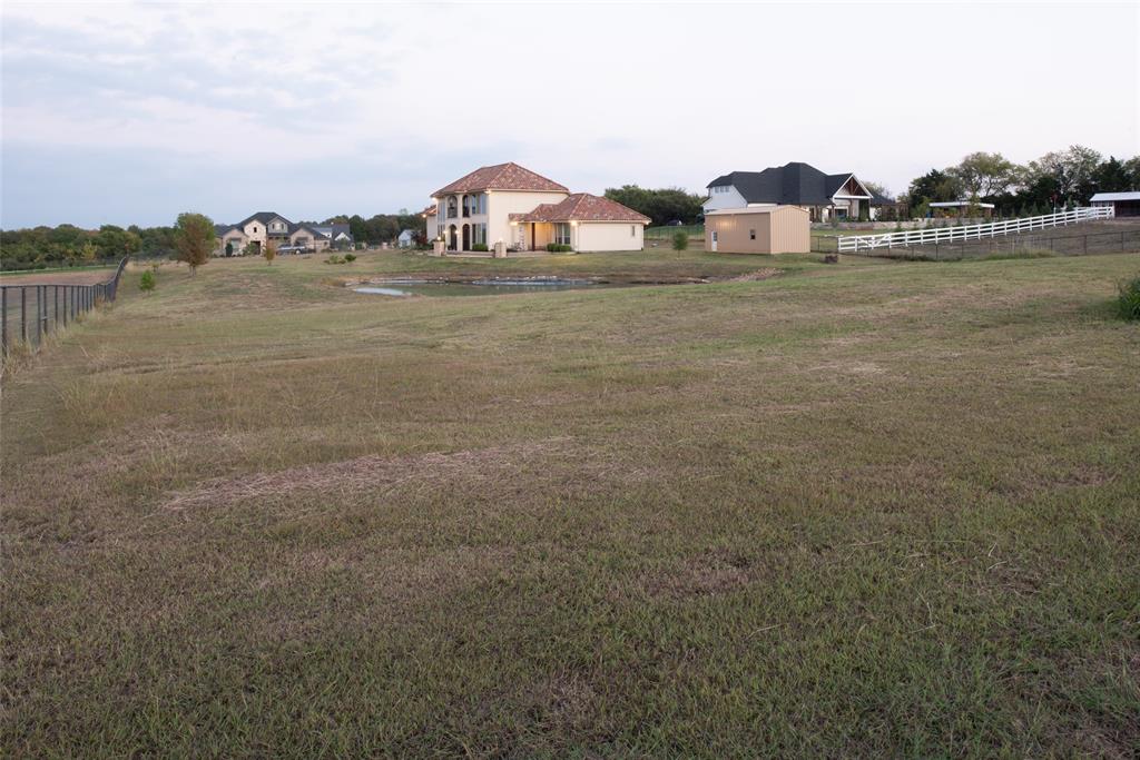 1755 Heifner Road Lucas, TX 75002 - Photo 34 of 35 a view of a house with a yard and a pond
