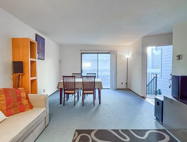 a view of yard from deck having patio