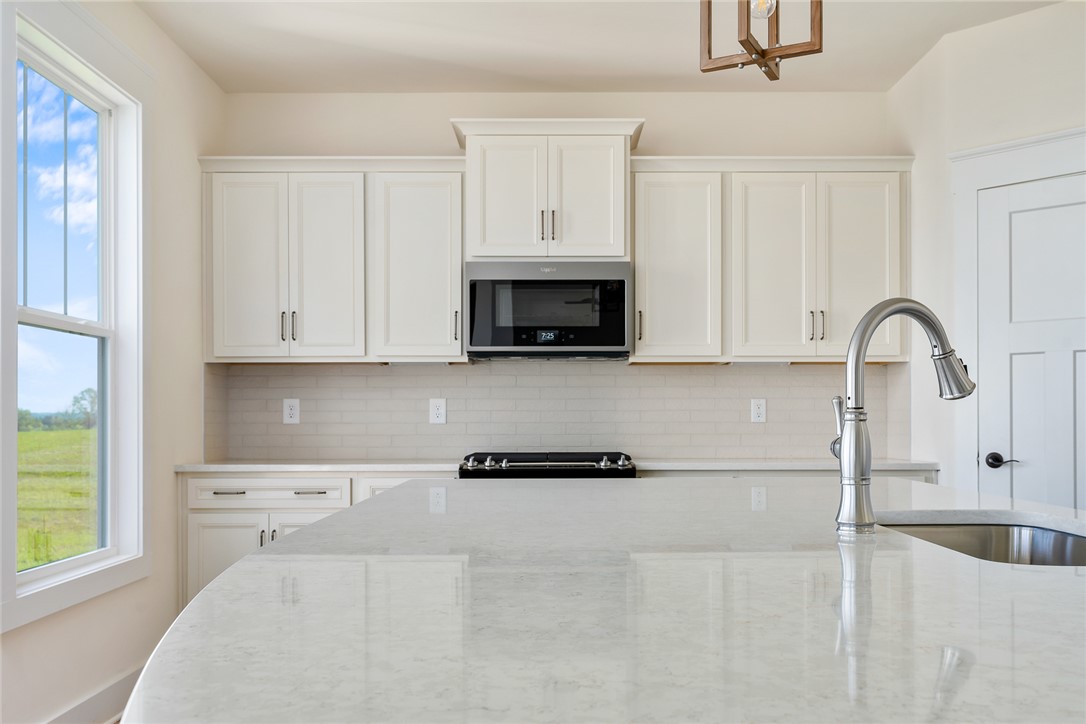 134 Ridgeline Row Central, SC 29630 - Photo 16 of 47 This modern kitchen features a spacious island and contemporary appliances, perfect for everyday living.