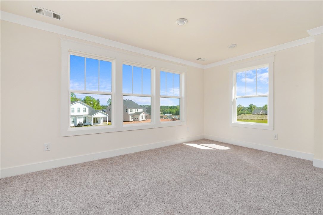 134 Ridgeline Row Central, SC 29630 - Photo 27 of 47 This spacious room features ample natural light and a comforting neutral palette.