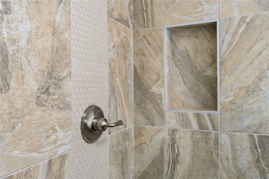 134 Ridgeline Row Central, SC 29630 - Photo 32 of 47 This shower features an integrated niche, combining practical storage with elegant tile work.