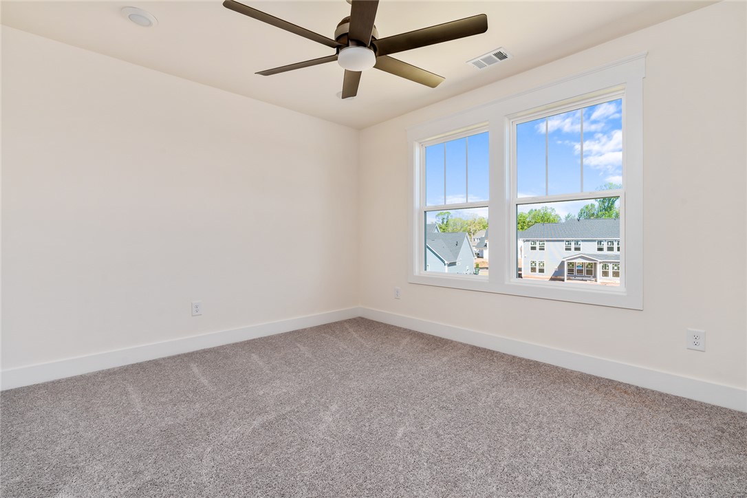 134 Ridgeline Row Central, SC 29630 - Photo 34 of 47 This spacious bedroom features ample natural light and a comforting atmosphere.