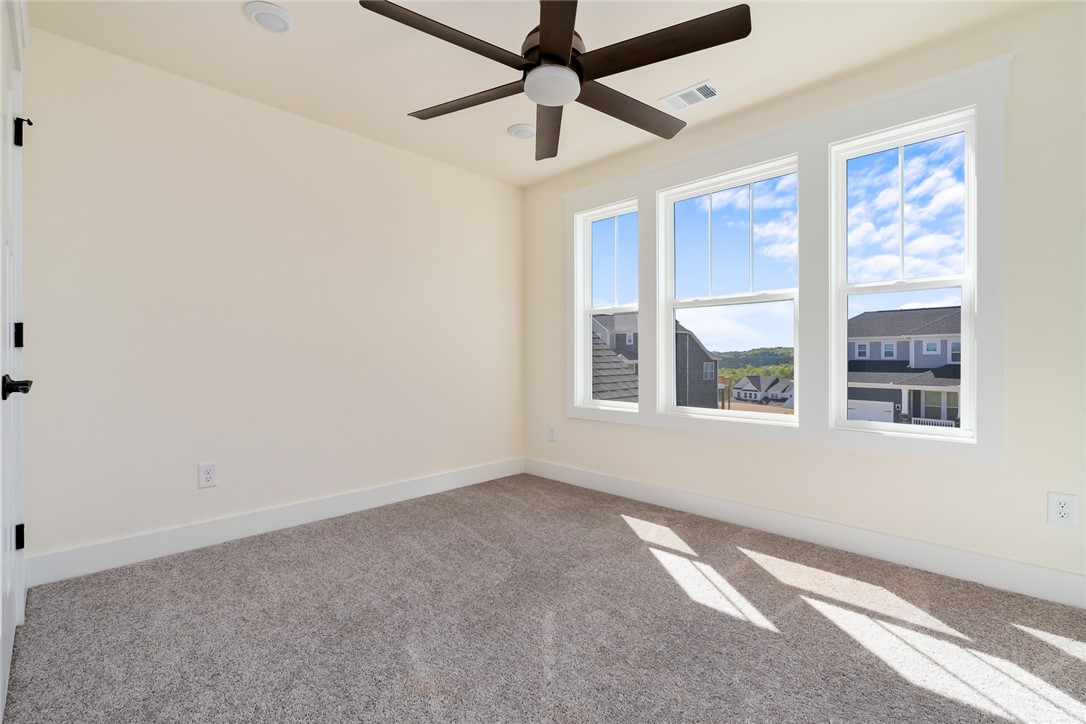 134 Ridgeline Row Central, SC 29630 - Photo 38 of 47 This spacious room features ample natural light and a comfortable atmosphere for relaxation.
