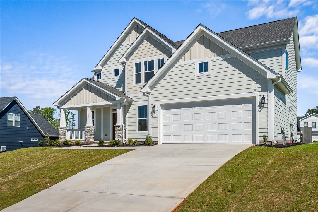134 Ridgeline Row Central, SC 29630 - Photo 4 of 47 This newly constructed residence showcases craftsman style design and a welcoming porch.