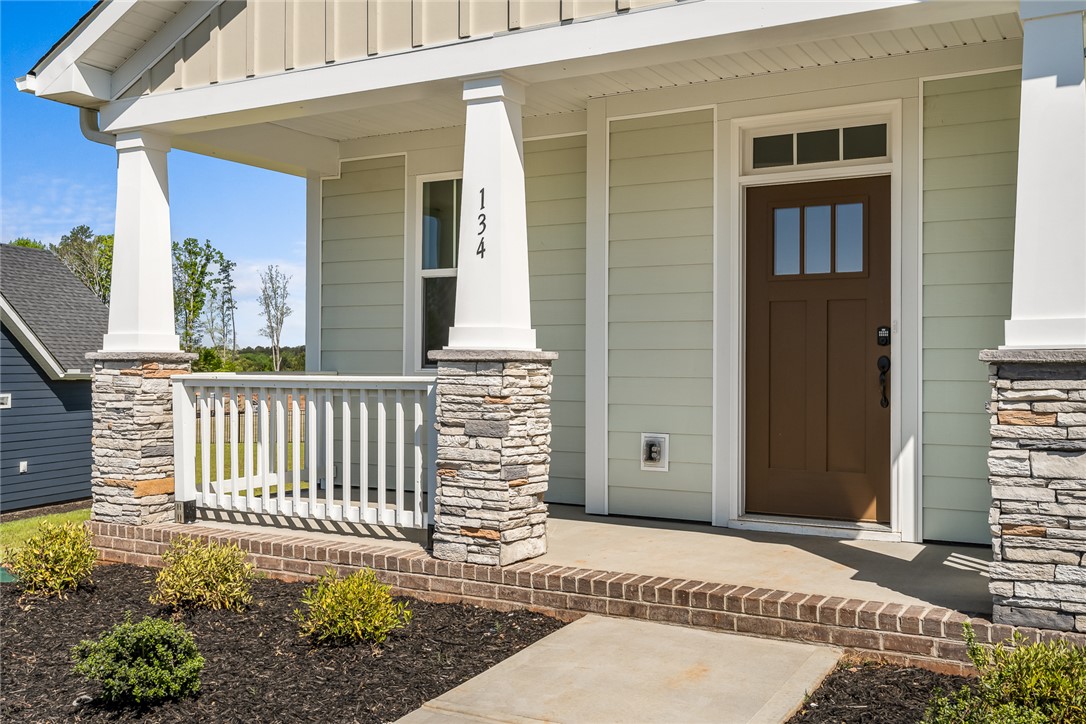 134 Ridgeline Row Central, SC 29630 - Photo 5 of 47 This inviting home features a charming porch and craftsman construction materials.