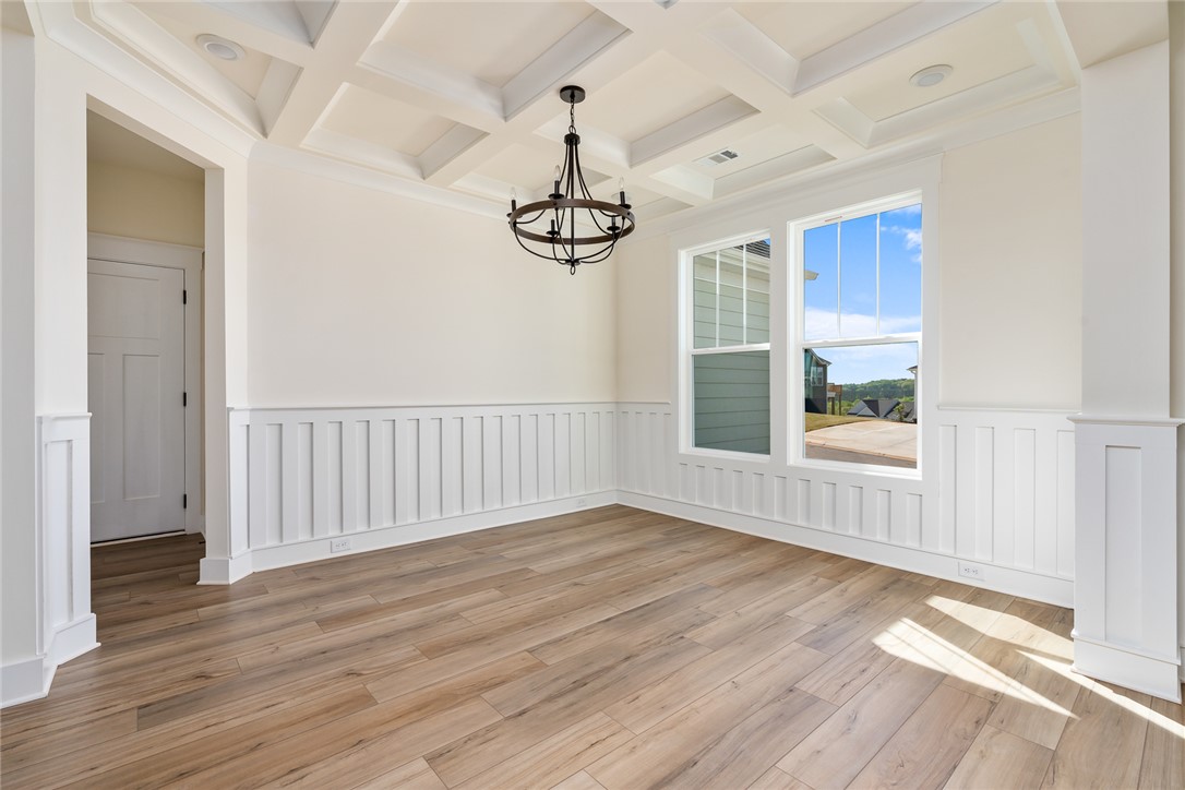 134 Ridgeline Row Central, SC 29630 - Photo 8 of 47 This bright room features elegant coffered ceilings and wainscoting.