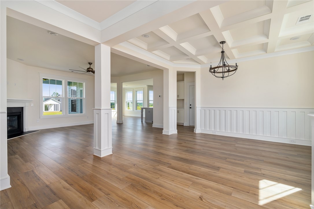 134 Ridgeline Row Central, SC 29630 - Photo 10 of 47 This bright and open interior boasts hardwood floors and elegant wainscoting.