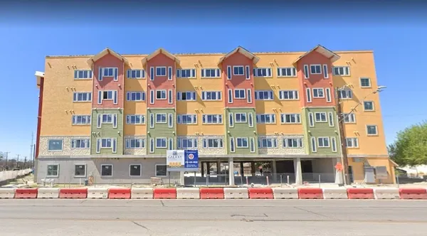 a front view of a multi story residential apartment building