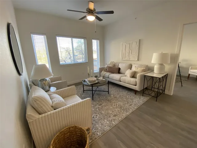 a living room with furniture and a large window
