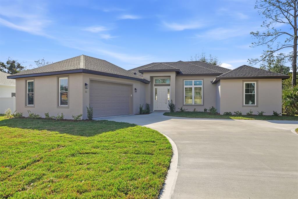 16 Pierce Lane Palm Coast, FL 32164 - Photo 41 of 47 a view of a house with a backyard