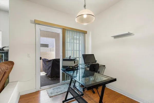 a workspace with furniture and wooden floor
