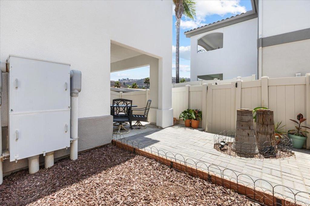 2715 Lake Pointe Drive, Unit 116 Spring Valley, CA 91977 - Photo 21 of 23 a bedroom with a bed a table and chair