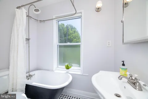 a bathroom with a sink and bathtub