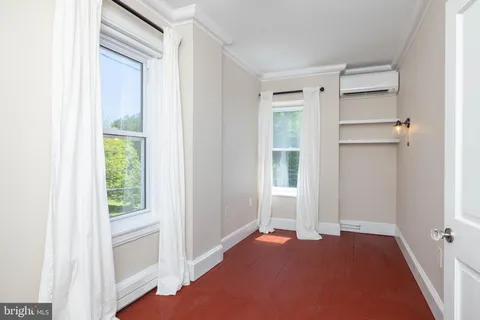 a view of an empty room with a window