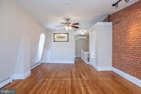a view of a livingroom with wooden floor
