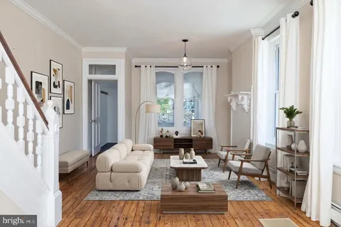 a living room with furniture and a table