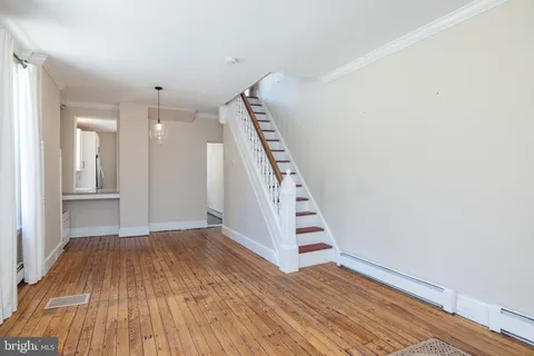 a view of wooden floor in an empty room
