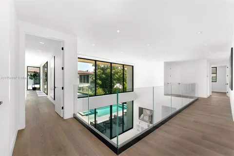 a living room with furniture and a lamp