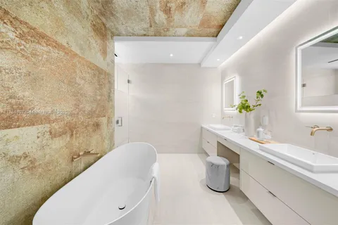 a bathroom with a sink and mirror