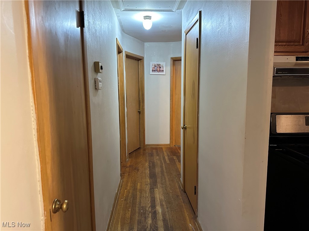 12303 Orme Road Garfield Heights, OH 44125 - Photo 10 of 22 Hall featuring dark wood finished floors