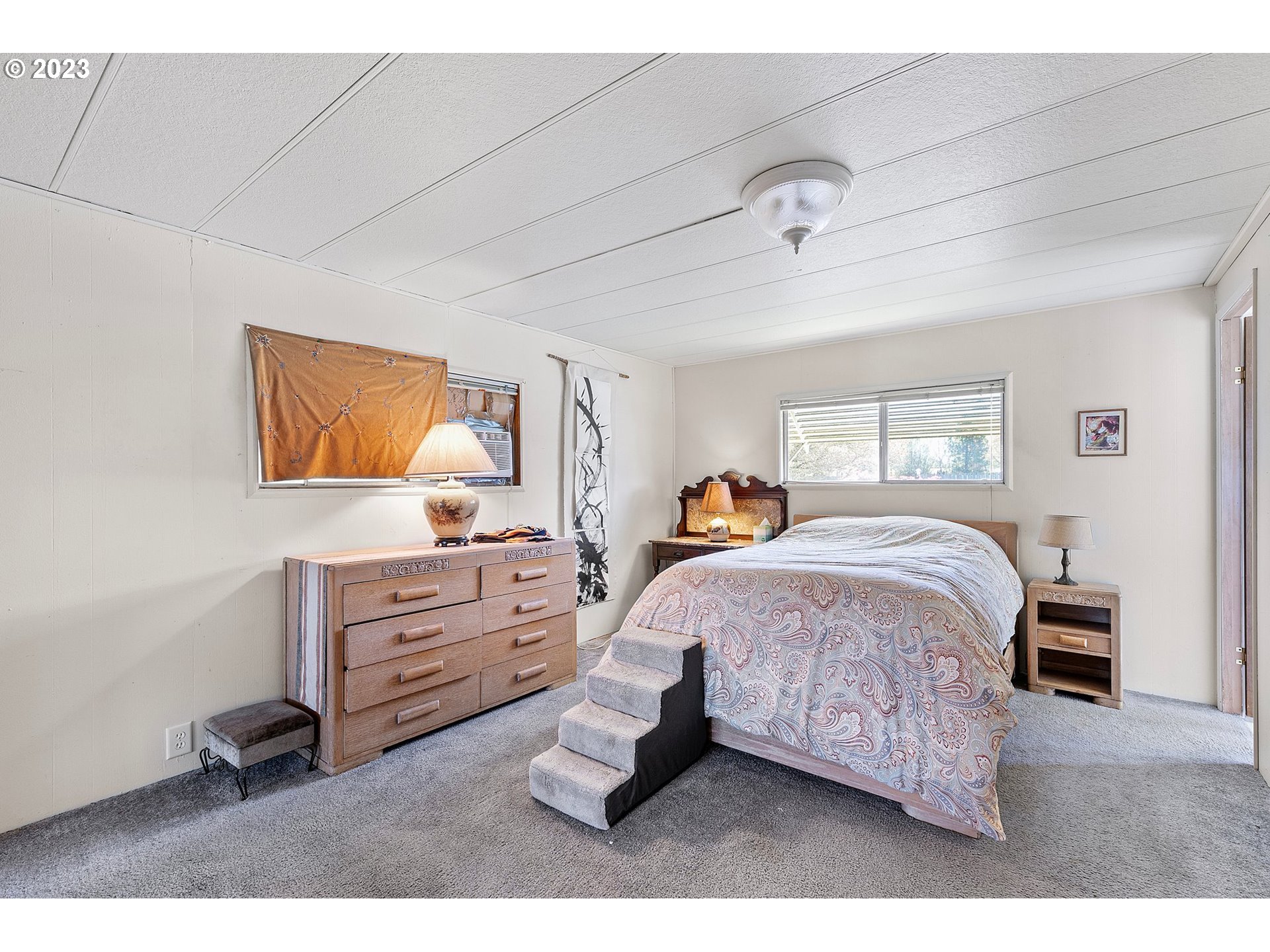 3530 East Game Farm Road Springfield, OR 97477 - Photo 17 of 38 a bedroom with a bed window and dresser