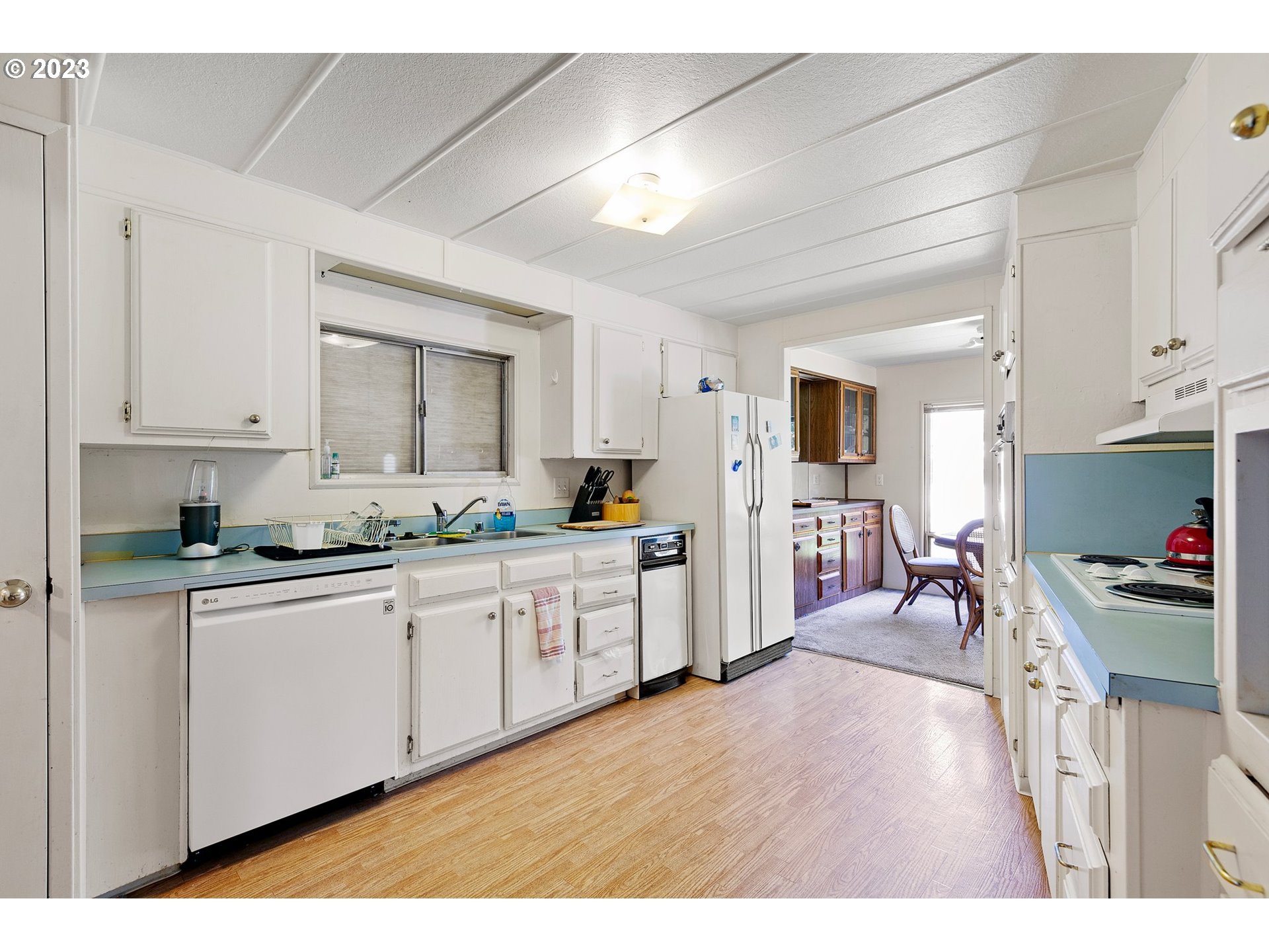 3530 East Game Farm Road Springfield, OR 97477 - Photo 24 of 38 a large white kitchen with stainless steel appliances