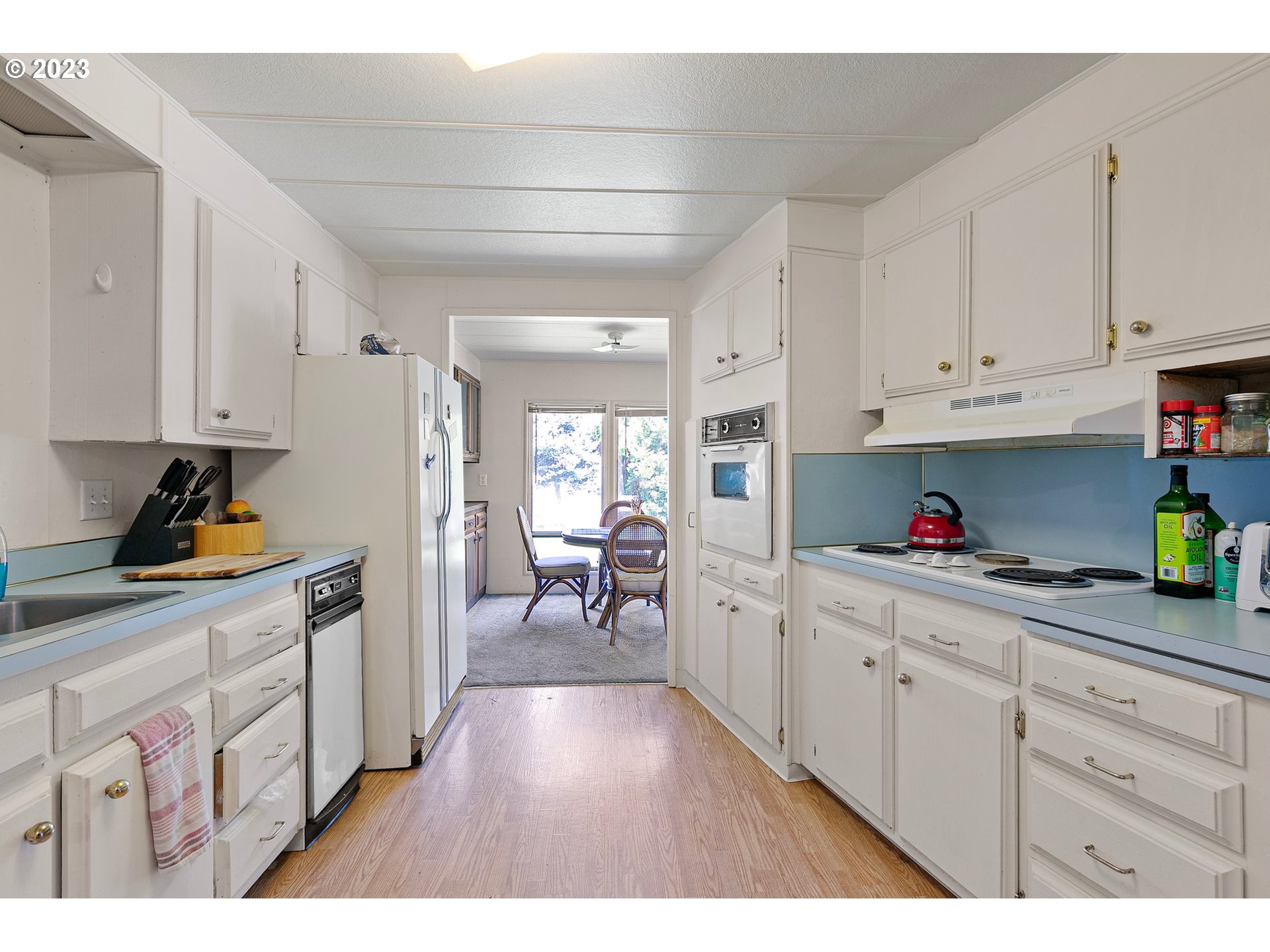 3530 East Game Farm Road Springfield, OR 97477 - Photo 25 of 38 a kitchen with white cabinets and sink