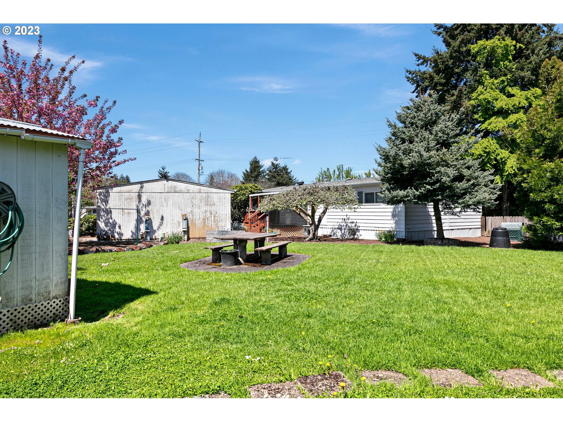3530 East Game Farm Road Springfield, OR 97477 - Photo 31 of 38 a view of a house with backyard and sitting area