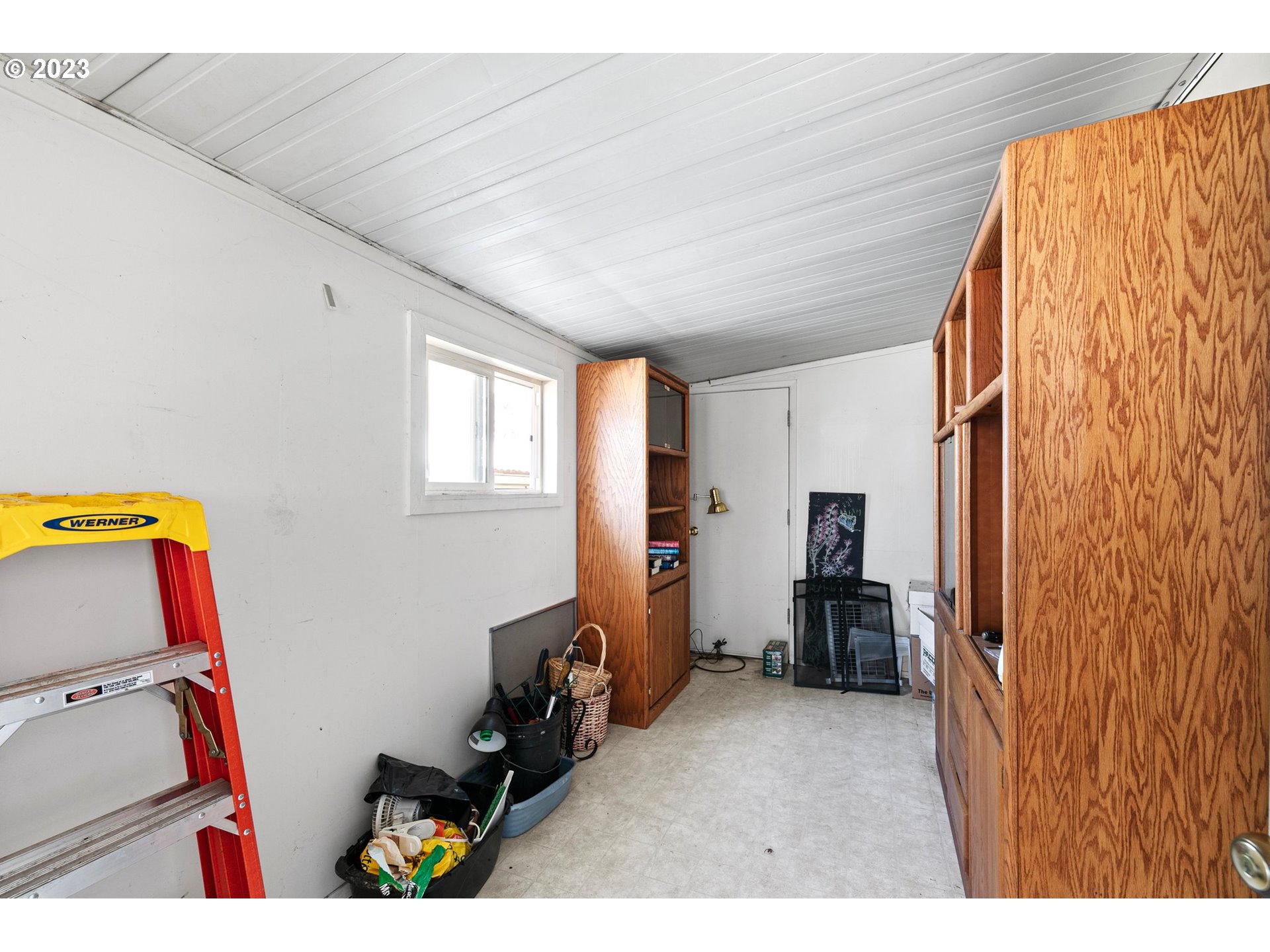 3530 East Game Farm Road Springfield, OR 97477 - Photo 36 of 38 a view of room with furniture and refrigerator