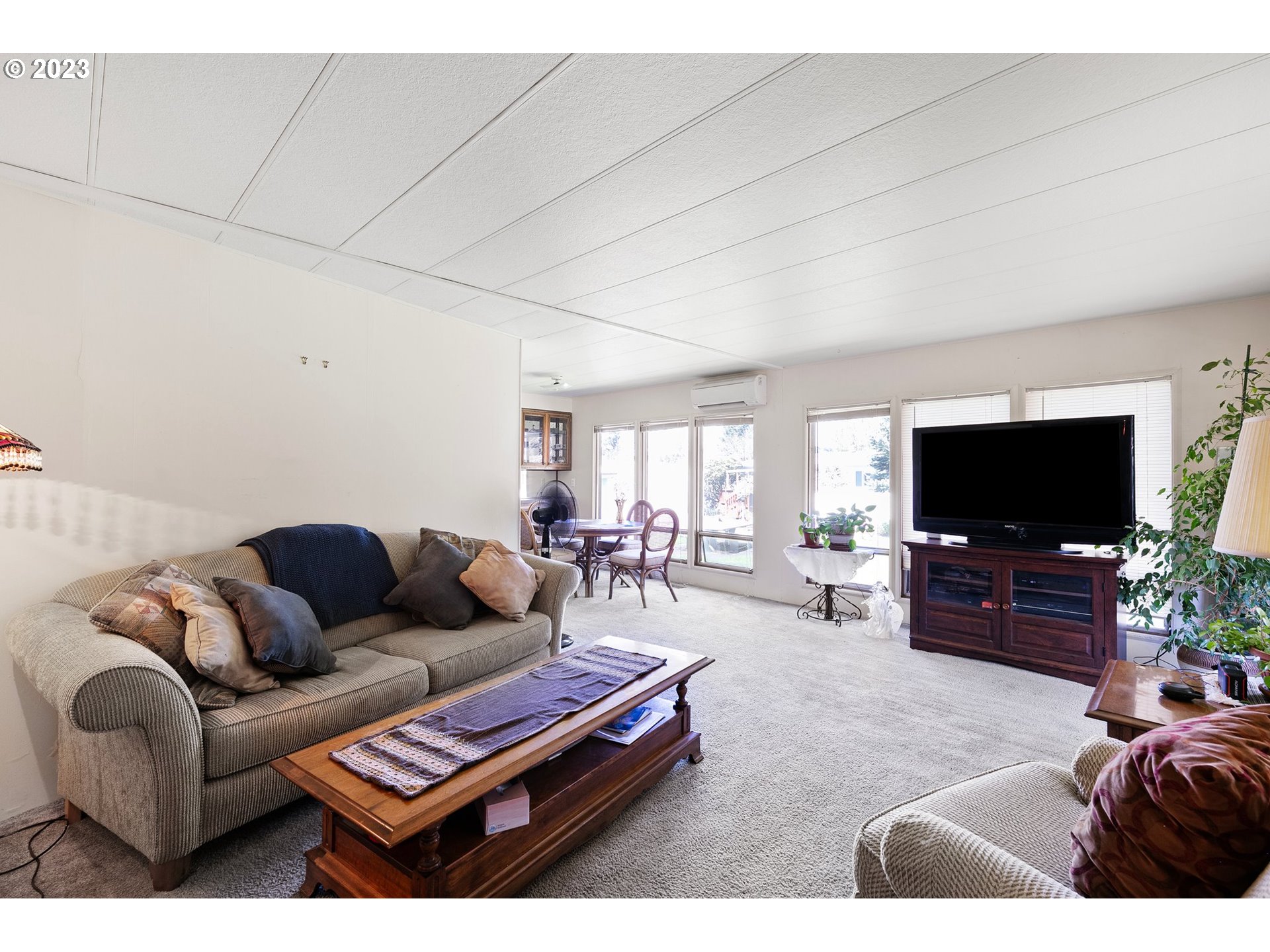 3530 East Game Farm Road Springfield, OR 97477 - Photo 7 of 38 a living room with furniture and a flat screen tv