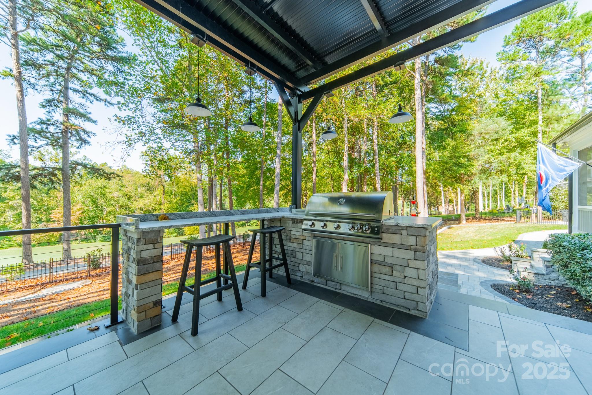 1946 Brawley School Road Mooresville, NC 28117 - Photo 11 of 48 a balcony with chairs and with a stove