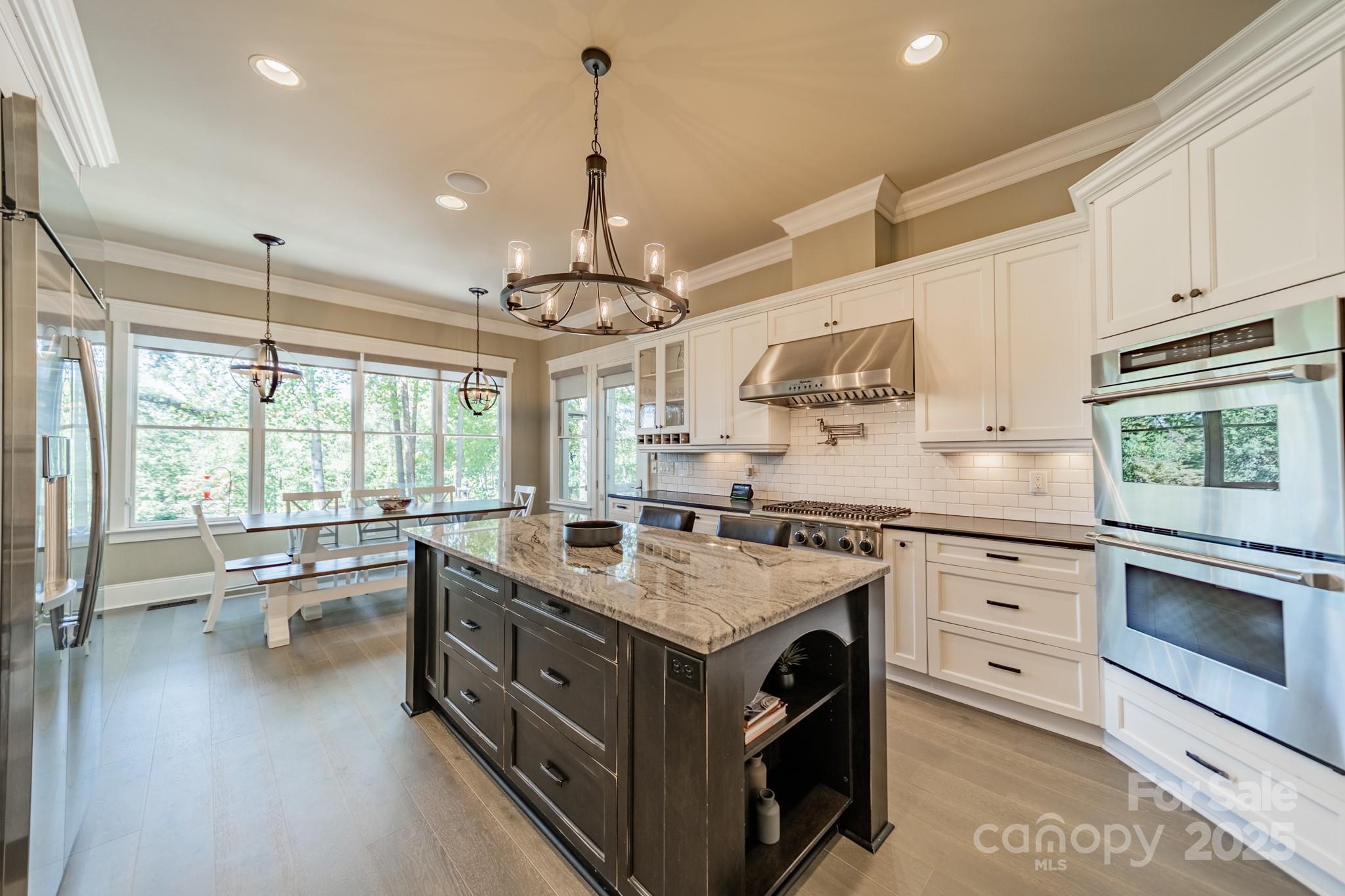 1946 Brawley School Road Mooresville, NC 28117 - Photo 19 of 48 a kitchen with a stove sink and view living room