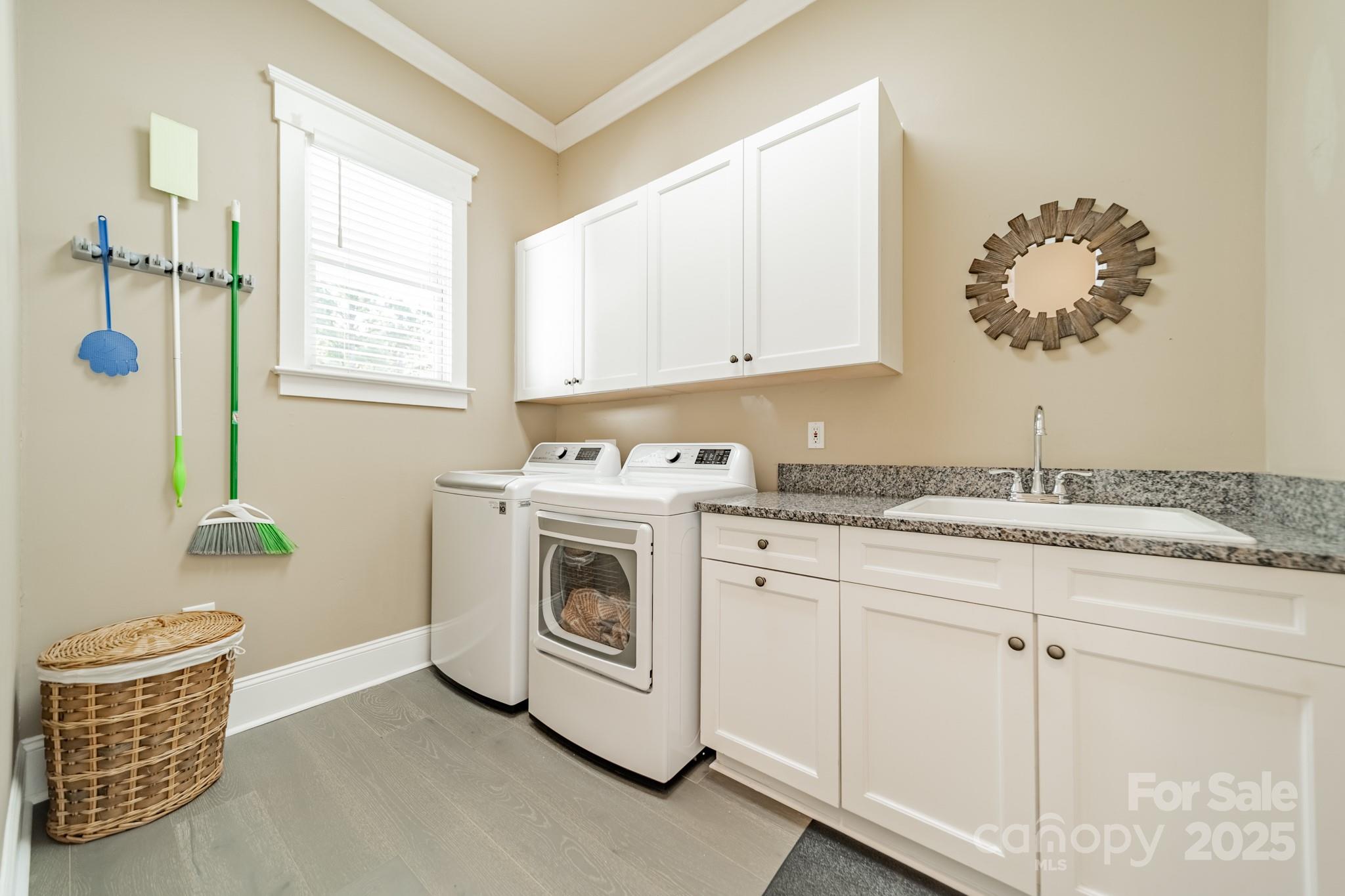 1946 Brawley School Road Mooresville, NC 28117 - Photo 23 of 48 a utility room with cabinets washer and dryer