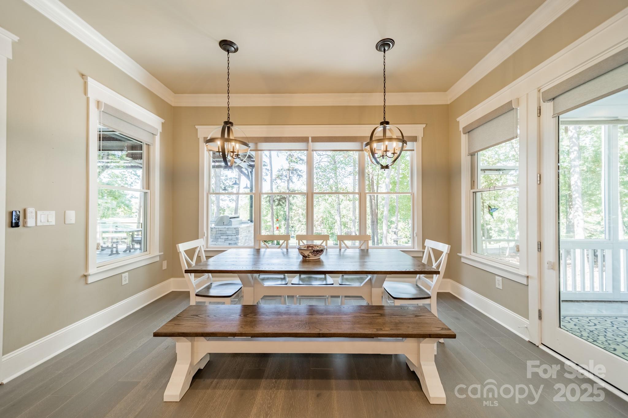 1946 Brawley School Road Mooresville, NC 28117 - Photo 24 of 48 a view of a dining room with furniture wooden floor and chandelier
