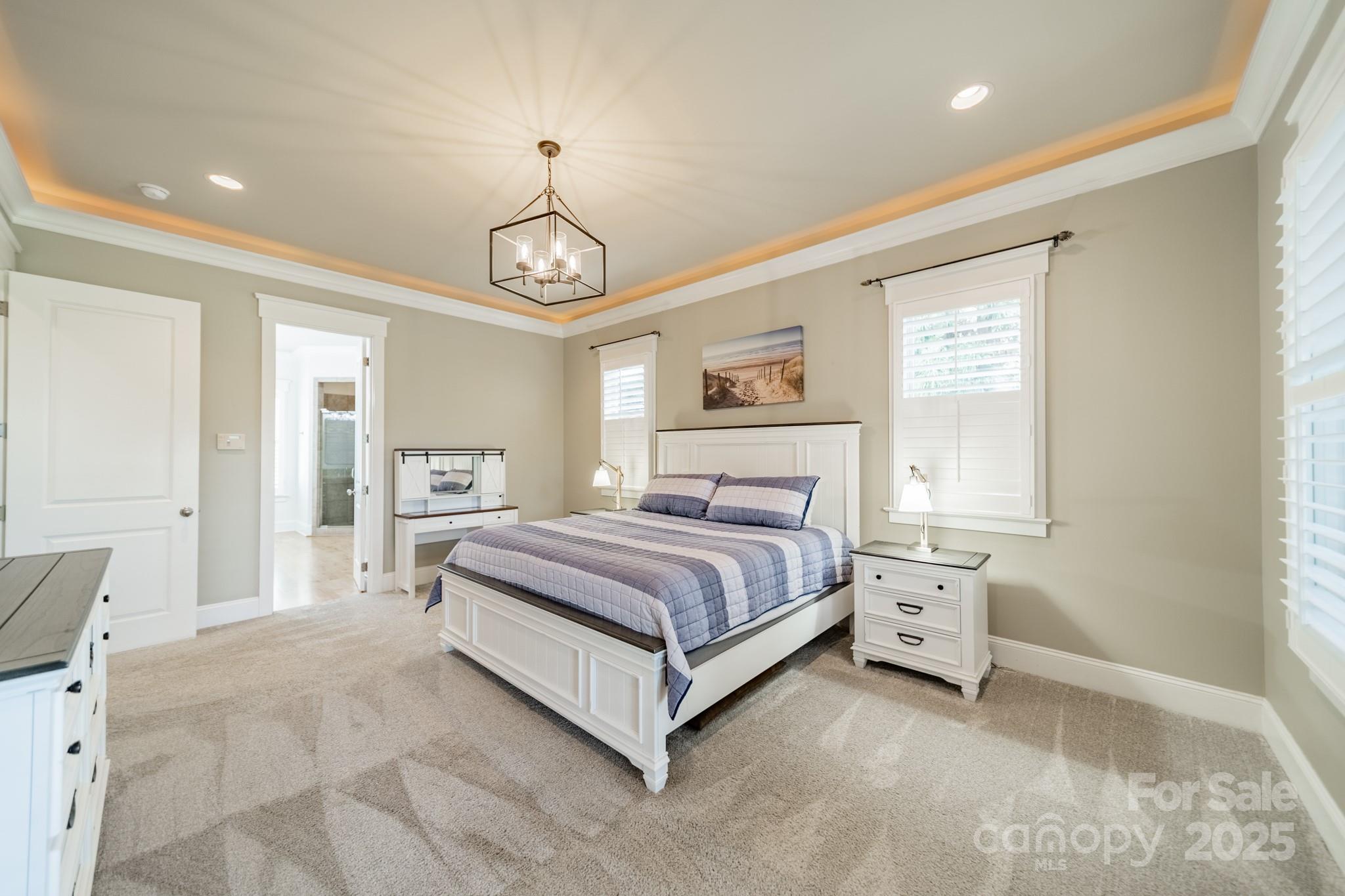 1946 Brawley School Road Mooresville, NC 28117 - Photo 26 of 48 a spacious bedroom with a bed and a window