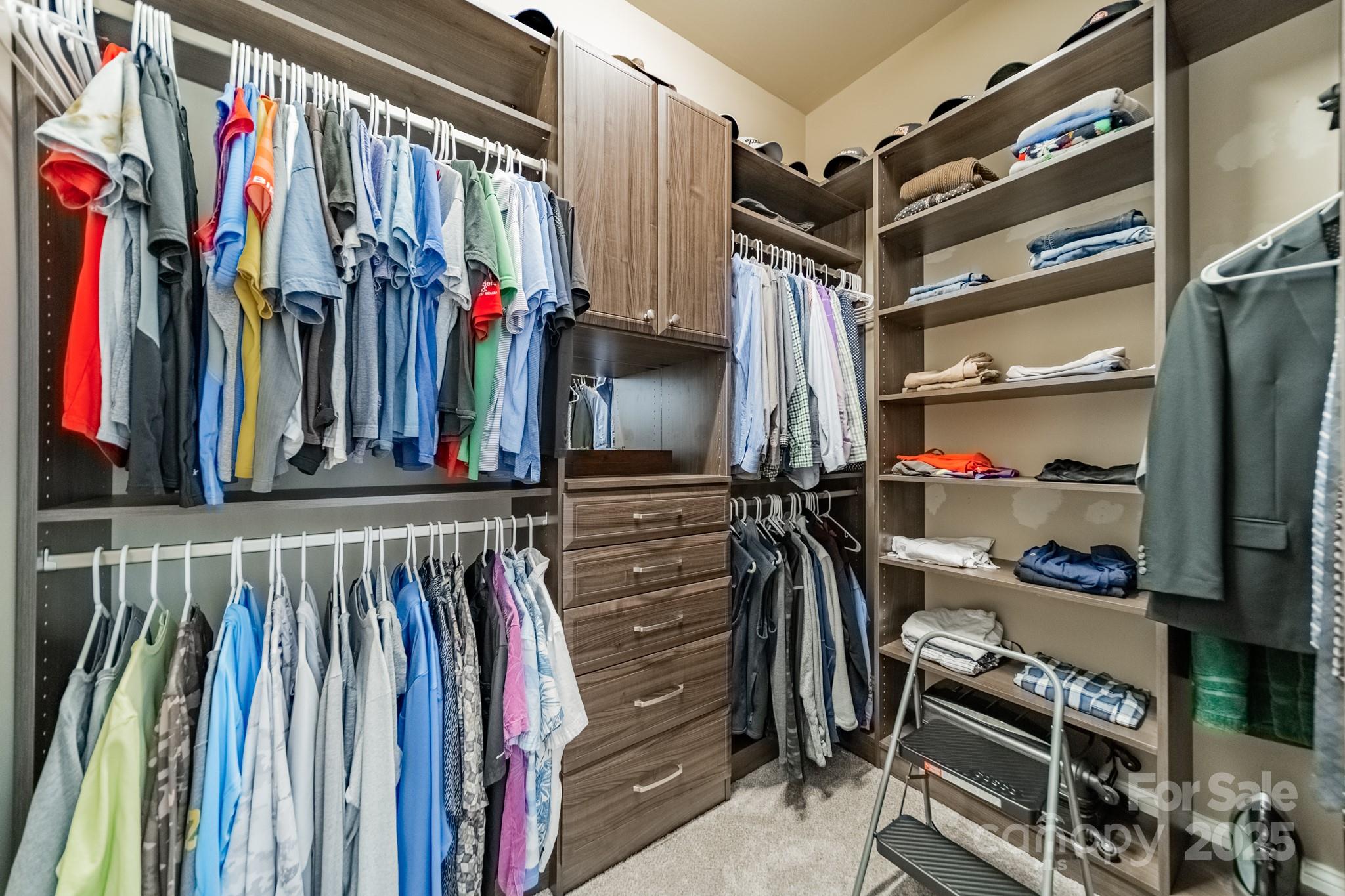 1946 Brawley School Road Mooresville, NC 28117 - Photo 27 of 48 a view of walk in closet with clothes and shoes
